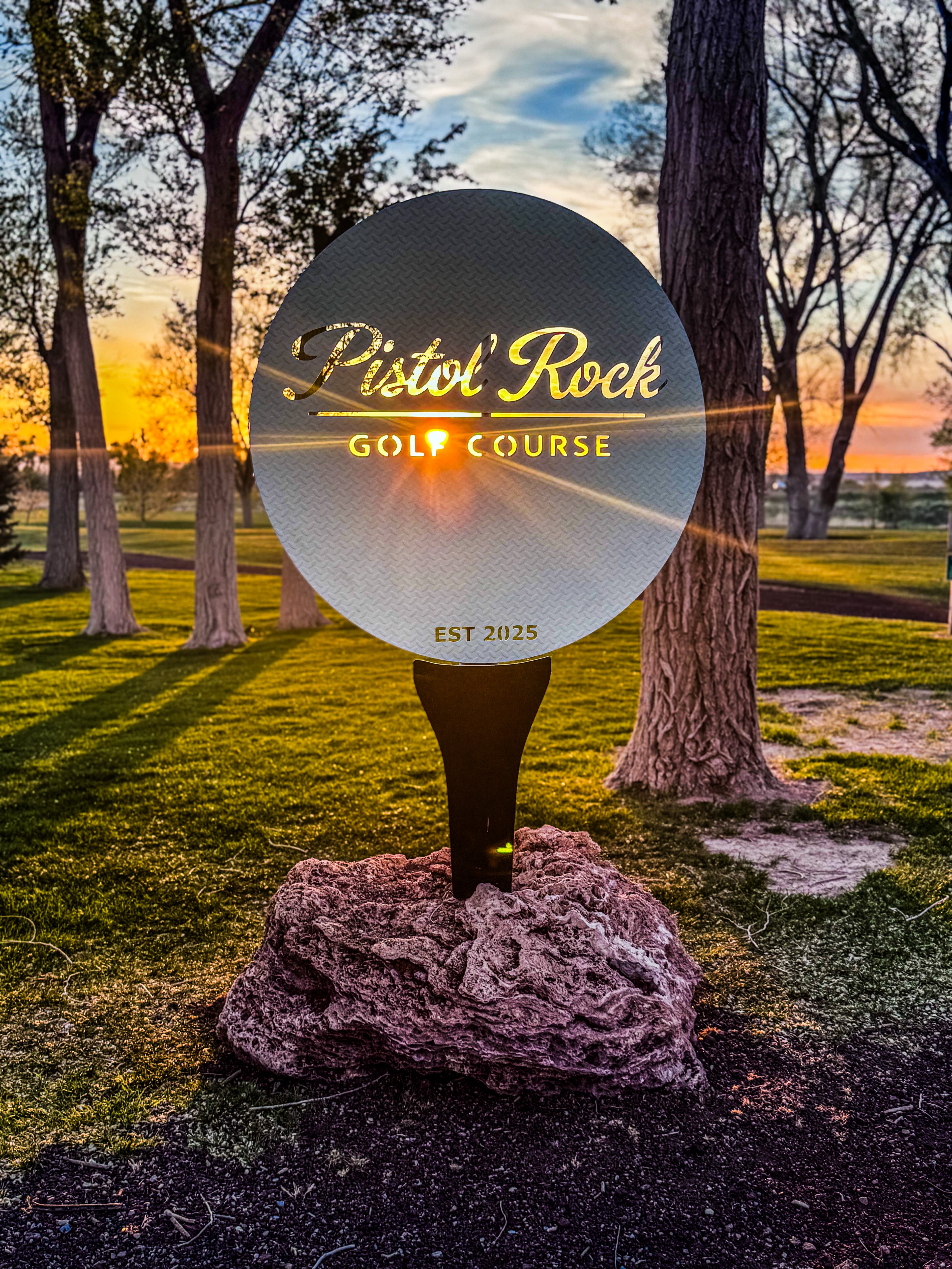 Pond and fairway at Pistol Rock Golf Course with the Pahvant Range behind